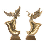 Gold angel figurines on white background