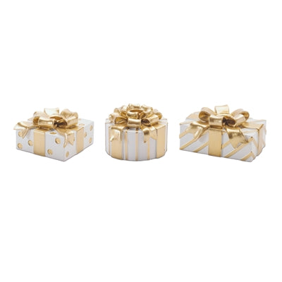 Three decorative gift boxes with gold accents on a white background