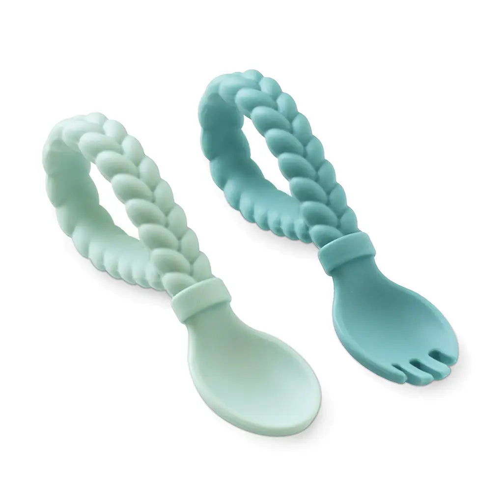 Two turquoise silicone utensils with braided handles on a white background