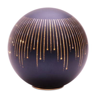 Decorative sphere with gold star patterns on a white background