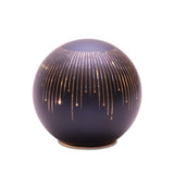 Decorative spherical object with gold accents on a white background