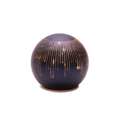 Decorative spherical object with gold lines on a white background