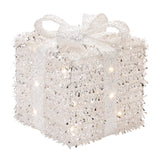 Decorative white box with lights and a bow on a white background