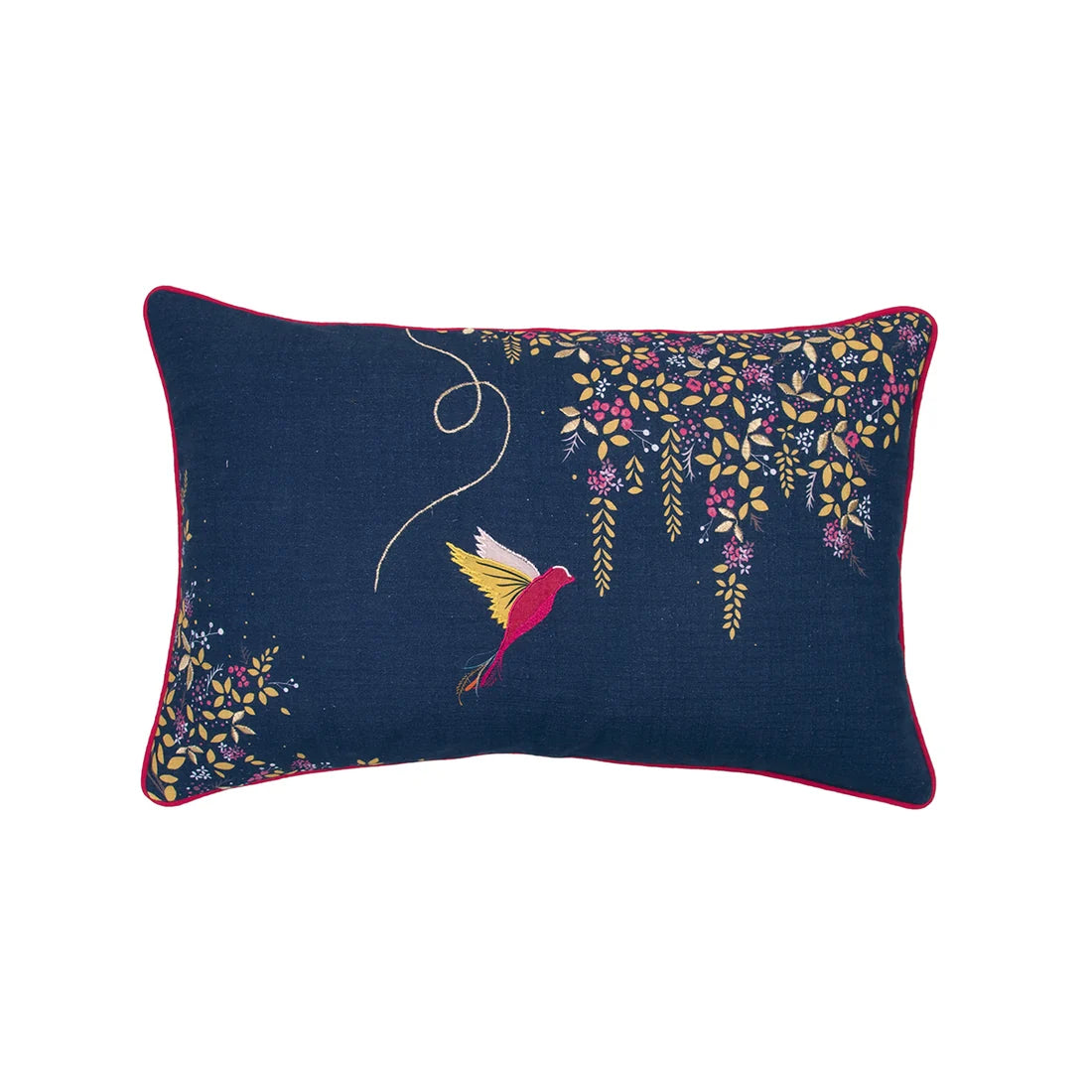 A rectangular navy blue decorative throw pillow with a red piped edge, featuring a colorful embroidered bird and floral vine motifs on a white background.