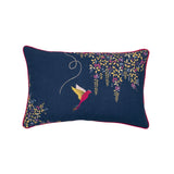A rectangular navy blue decorative throw pillow with a red piped edge, featuring a colorful embroidered bird and floral vine motifs on a white background.
