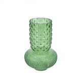 A light green textured glass vase with a flared, ribbed neck and a rounded, diamond-patterned base, shown on a plain white background.