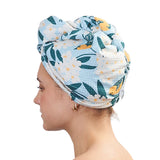 Woman wearing a floral patterned towel on her head against a white background