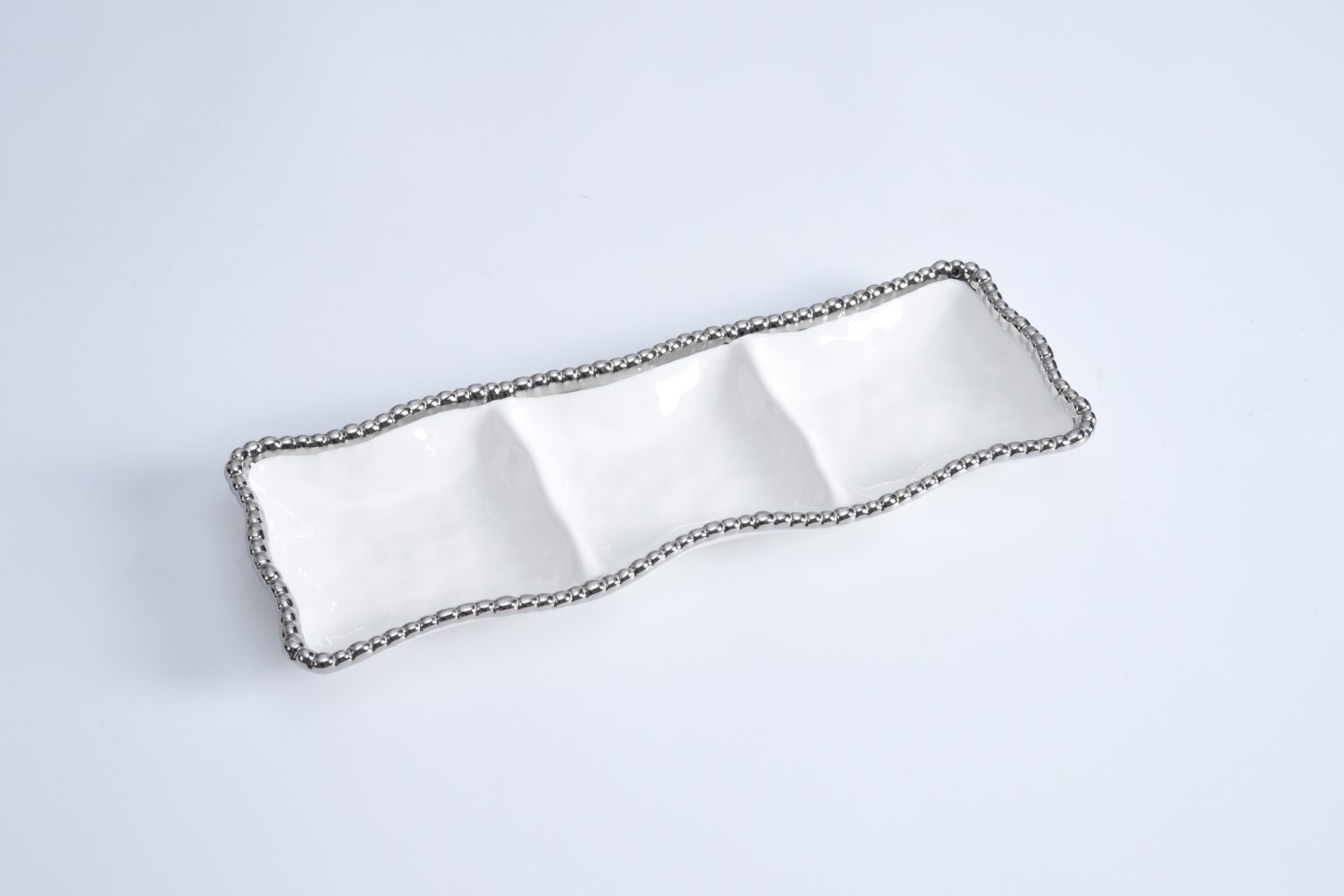 Silver chain belt on a light gray background