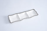 Silver chain belt on a light gray background