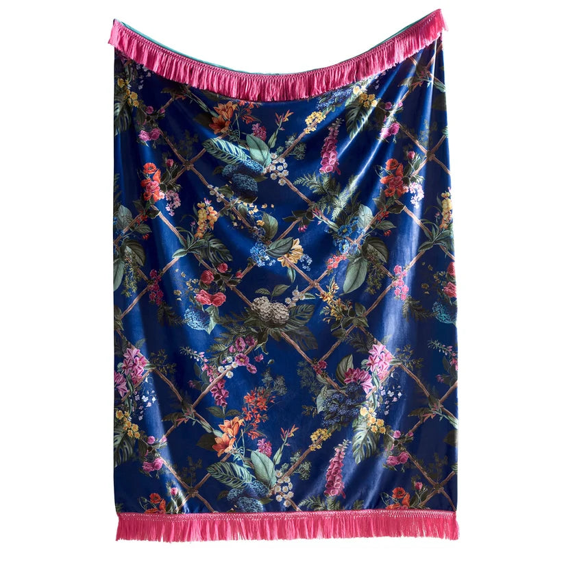 Floral patterned fabric with pink trim on a white background