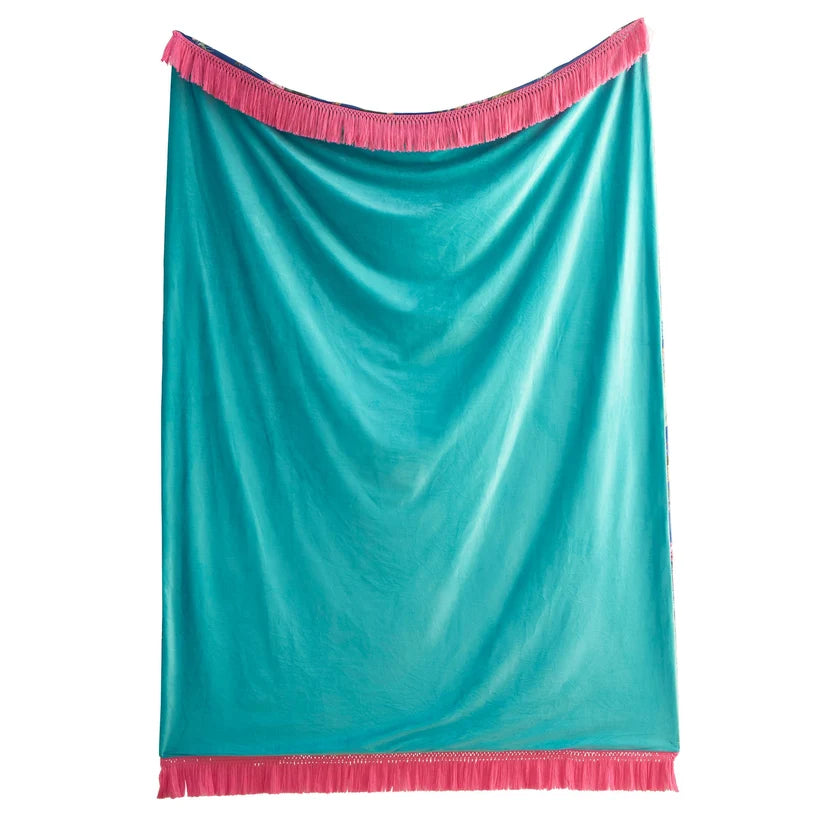 A turquoise blue satin-like throw blanket with bright pink fringe trim on the top and bottom, displayed against a solid white background.
