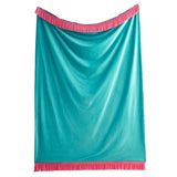 A turquoise blue satin-like throw blanket with bright pink fringe trim on the top and bottom, displayed against a solid white background.