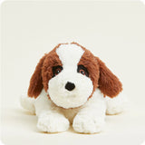Stuffed dog toy with brown and white fur on a light background