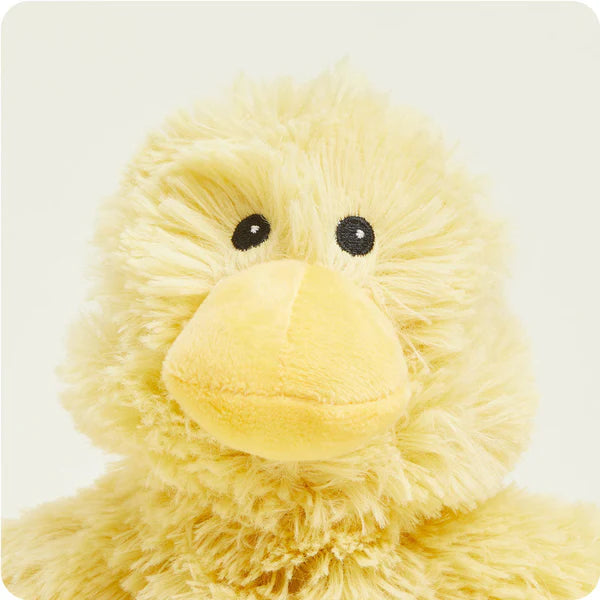 Yellow plush duck toy on a white background