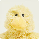 Yellow plush duck toy on a white background