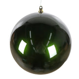 Glossy green spherical ornament on a white background
