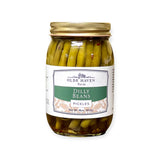 A jar of Olde Haven Farm Dilly Beans Pickles with a white and green label and a gold metal lid, set against a plain white background.