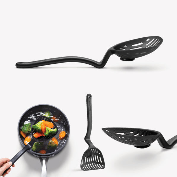 Black slotted spoon with handle, spatula, and frying pan on a white background