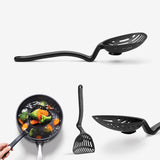 Black slotted spoon with handle, spatula, and frying pan on a white background