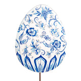 Decorative egg with blue floral pattern on a white background