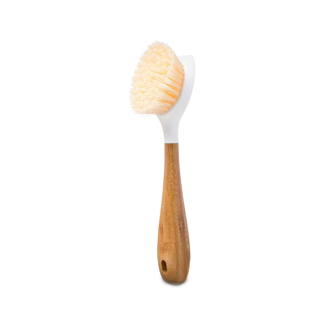 Bamboo scrubber with wooden handle and silicone head on a white background