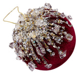 Decorative ornament with crystals on a red background