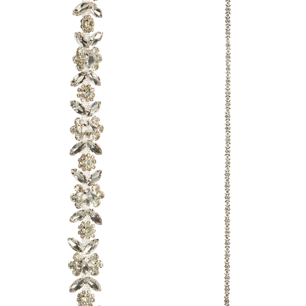 Delicate silver necklace with floral design on a white background
