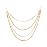 A gold-toned multi-layered chain necklace with beaded strands and spiral wire ends, displayed on a clean white background.