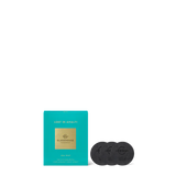 Tea packaging with a teal box and black tea bags on a white background