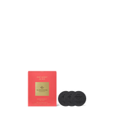 Red packaging with black discs on a white background