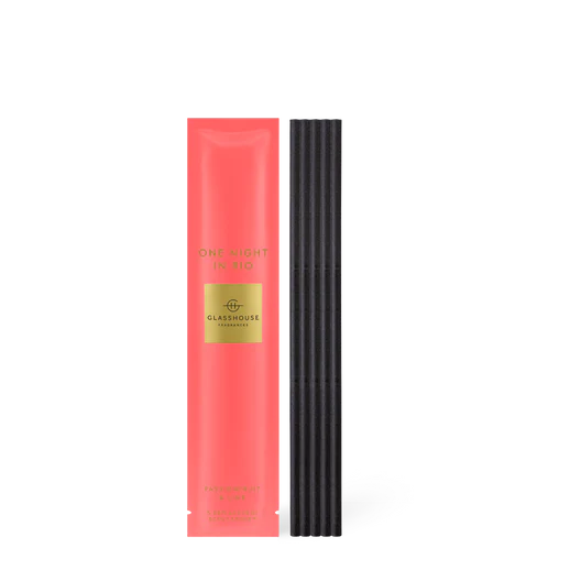 Pink packaging with gold label and black sticks on a white background