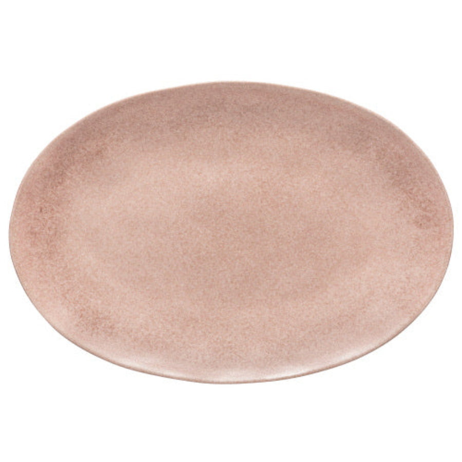 Round pink ceramic plate on a white background