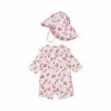 A baby bathing suit with a pink background featuring ice cream cone patterns, along with a matching hat.