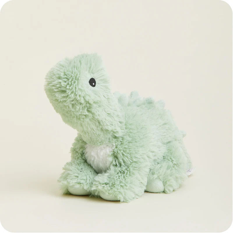 Light green plush dinosaur toy on a white background