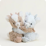 Two plush toys, one brown and one gray, sitting together on a white background