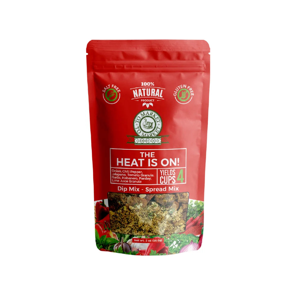 A red stand-up pouch of Calipso Foods 'The Heat Is On!' Dip Mix - Spread Mix, featuring a clear window at the bottom showing the textured dip mix inside, set against a plain white background.