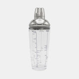 Clear cocktail shaker with silver top on a white background
