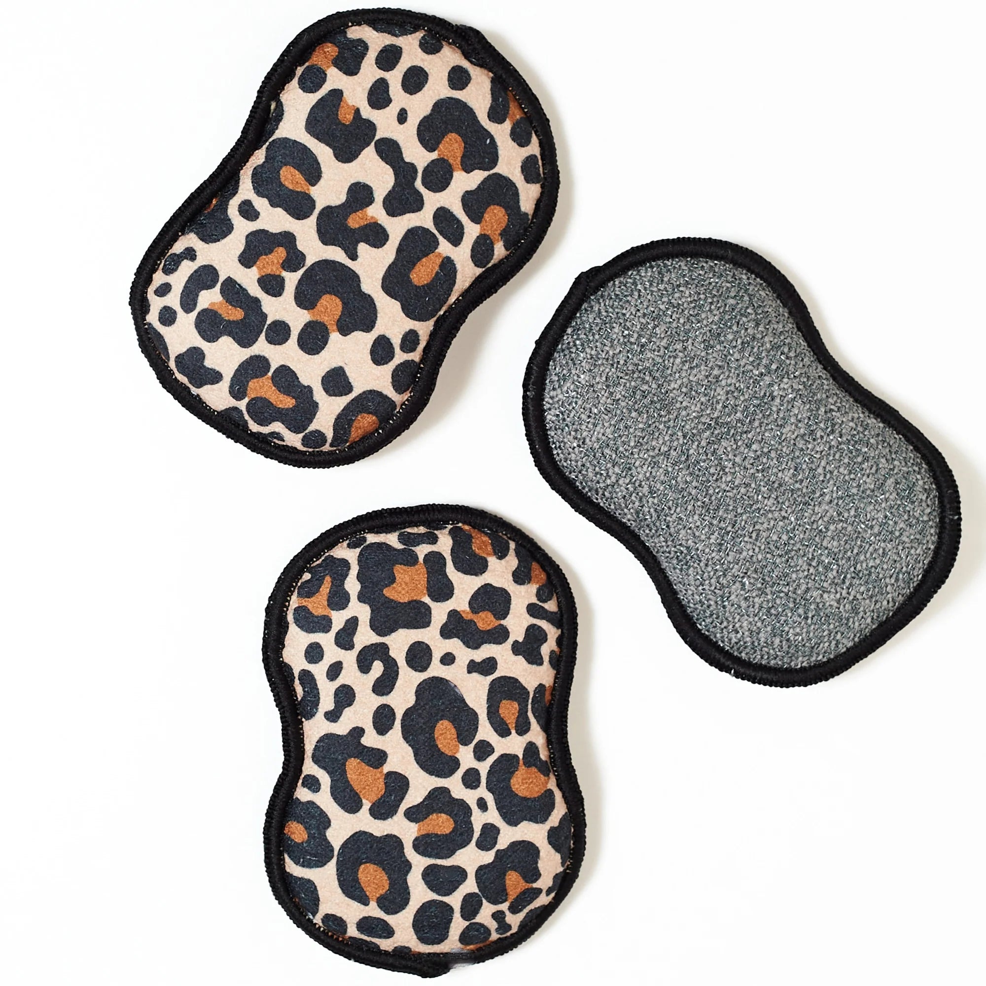 Two leopard print pads and one gray textured pad on a white background