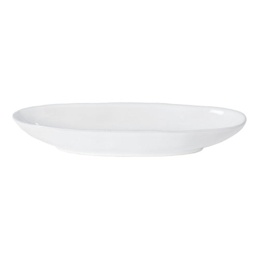 An oval platter with a matte black finish on a white background.