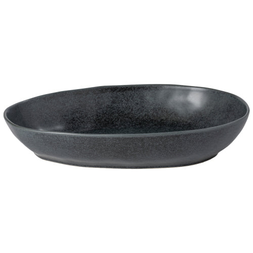 An oval-shaped, matte black ceramic baking dish with a textured surface.