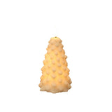 A textured, tree-shaped candle with a warm yellow glow, featuring a raised bubble pattern and a white wick at the top, isolated on a white background.