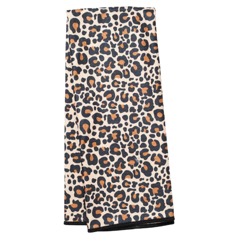 Folded towel with leopard print pattern on a white background