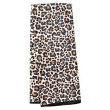 Folded towel with leopard print pattern on a white background