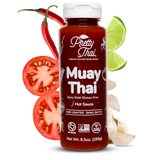 Bottle of Pretty Thai Muay Thai hot sauce with chili, lime, and tomato on a white background