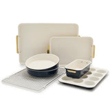 Set of ceramic cookware including a baking dish, loaf pan, and muffin tray on a white background.