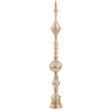 Decorative gold finial on a white background
