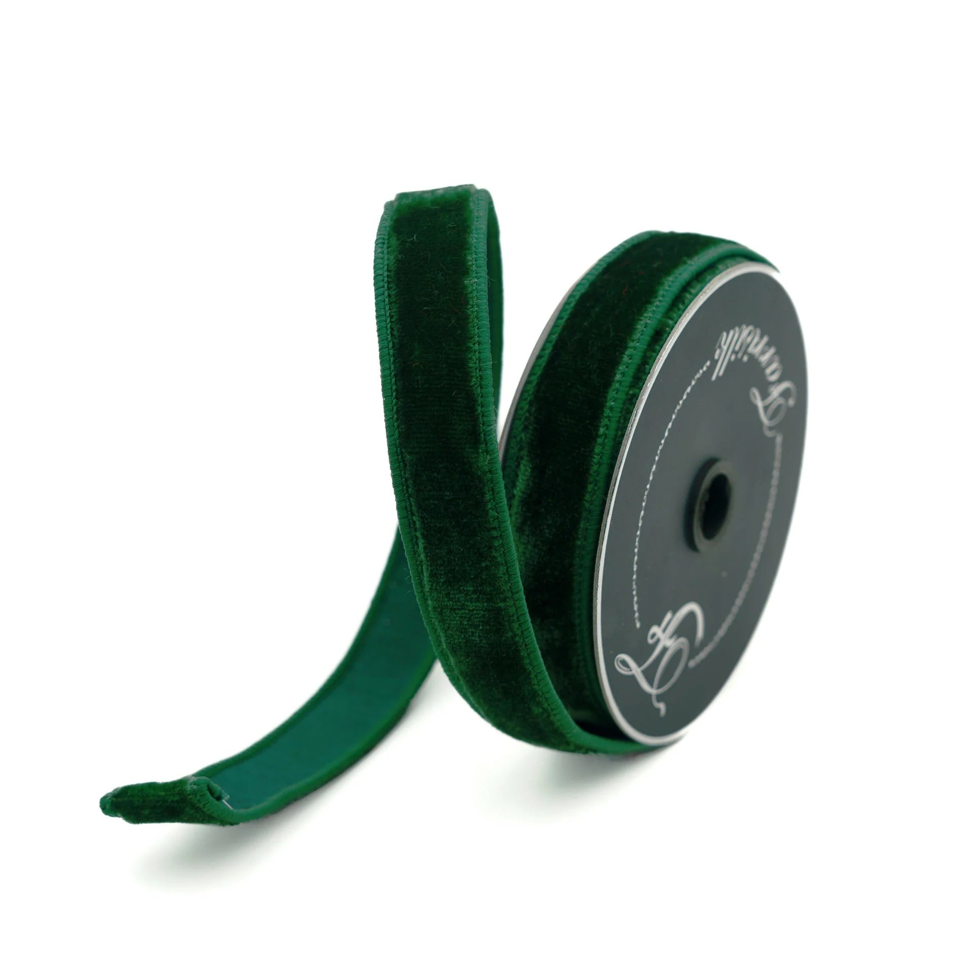 Green velvet ribbon on a spool with a visible brand logo on a white background