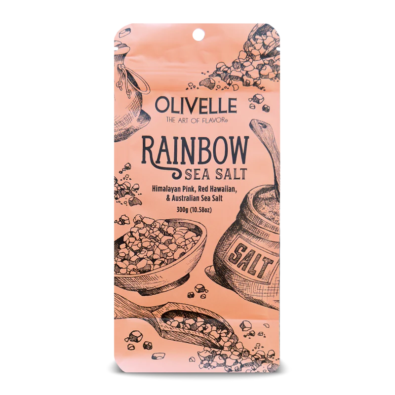 Packaging of Rainbow Sea Salt with illustrations of salt crystals and containers on a beige background, with the brand name 'Olivelle' and product name 'Rainbow Sea Salt' prominently displayed.