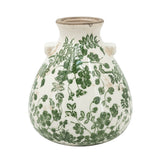 Ceramic vase with green floral pattern on a white background