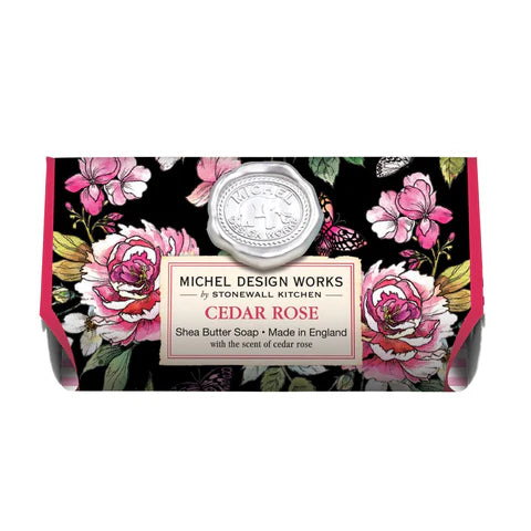 A bar of MD Cedar Rose soap with floral design and a metal lid, placed against a white background.